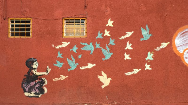 Stencil graffiti on a street in Oaxaca de Juárez, Mexico