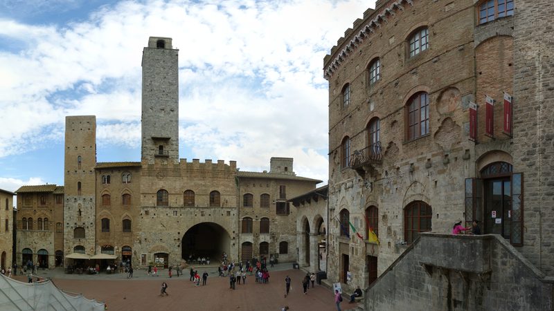 The Piazza del Duomo in San Gimignano, Italy, as seen from its western end.