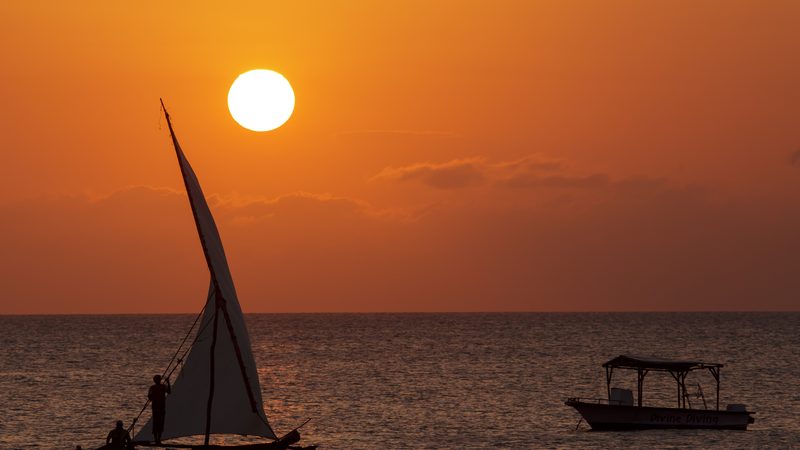 two types of boats during sunset on zanzibar - The image was taken during 5 weeks of traveling on an overlande